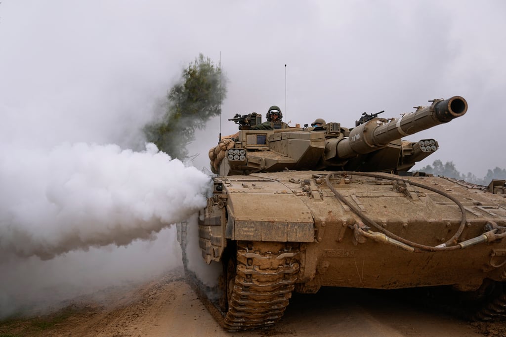 An Israeli army tank moves near the Israeli-Gaza border, in southern Israel. Photo: AP An Israeli army tank moves near the Israeli-Gaza border, in southern Israel. Photo: AP