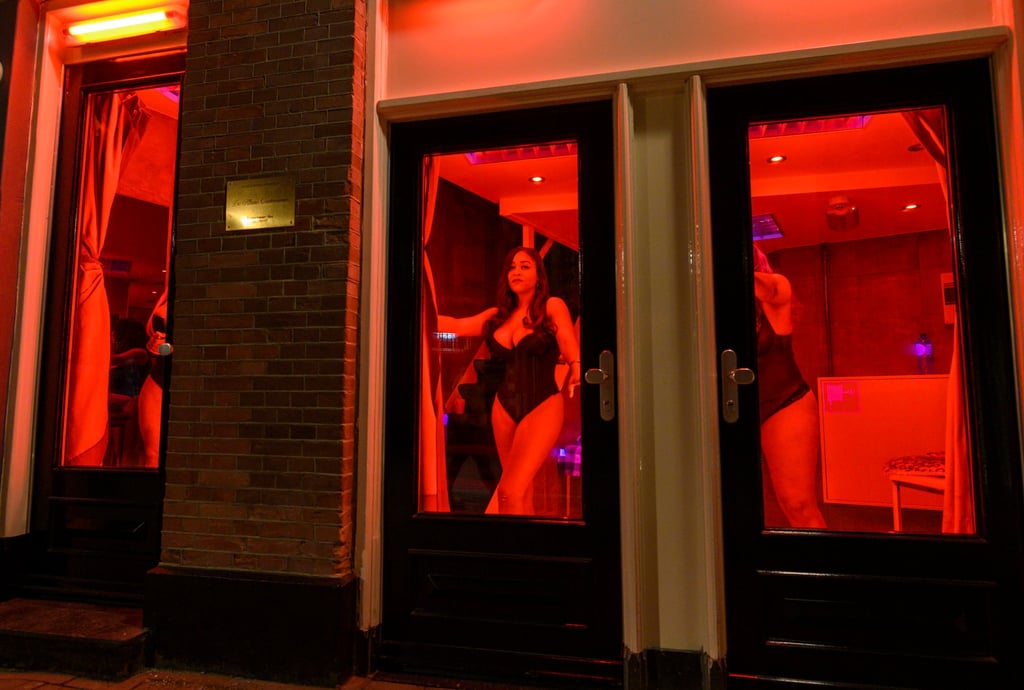 Prostitutes in the red light district of Amsterdam. Some countries, such as the Netherlands and Singapore, take a pragmatic approach to sex work, which is regulated and sometimes taxed. Not so Malaysia. Photo: Getty Images Prostitutes in the red light district of Amsterdam. Some countries, such as the Netherlands and Singapore, take a pragmatic approach to sex work, which is regulated and sometimes taxed. Not so Malaysia. Photo: Getty Images