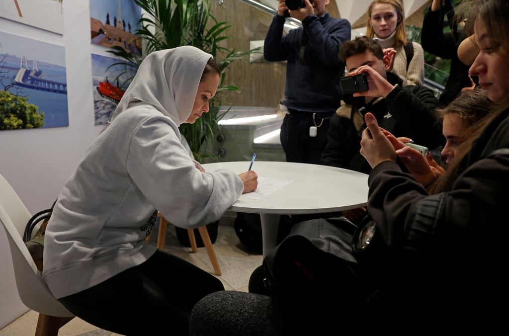 Maria Andreyeva, seen here in Moscow on Saturday, is among those Russian women demanding the return from the frontline of their husbands, sons and brothers. Photo: Reuters
