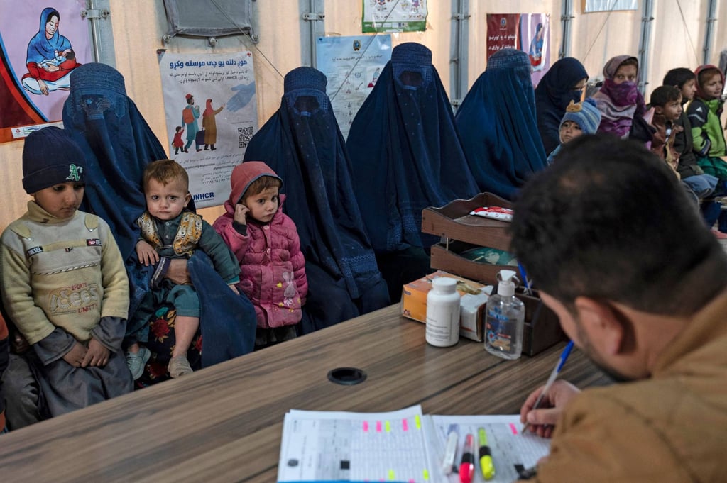 Afghan burka-clad women and children refugees deported from Pakistan, in a nutrition ward at the United Nations High Commissioner for Refugees camp on the outskirts of Kabul. Photo: AFP
