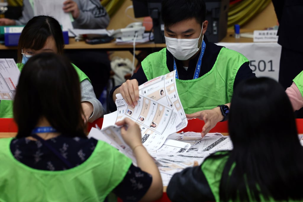 Election staff sort through votes at a counting station in Causeway Bay last December. Photo: Dickson Lee