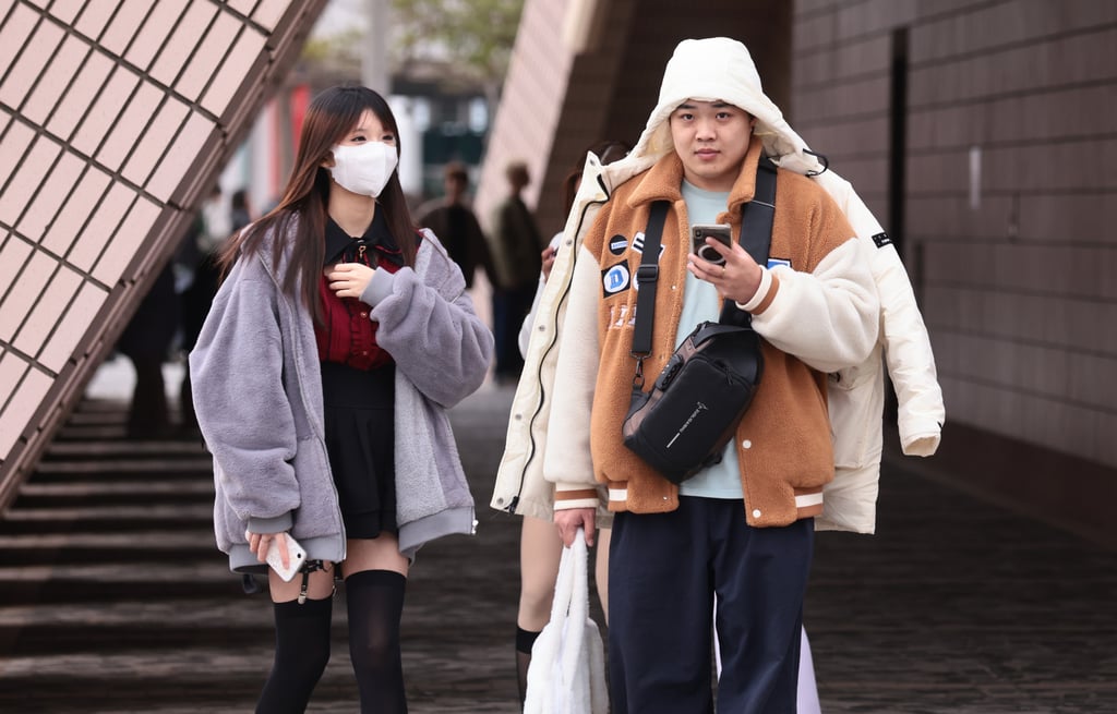 At least some people were dressing warmer on Monday. Temporary shelters across the city will remain open until the cold weather warning is lifted. Photo: May Tse At least some people were dressing warmer on Monday. Temporary shelters across the city will remain open until the cold weather warning is lifted. Photo: May Tse