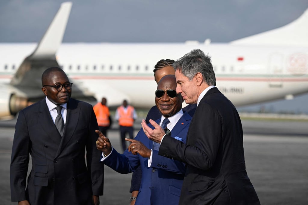 Ivory Coast’s Minister of Foreign Affairs Kacou Houadja Leon Adom, second right, and US Secretary of State Antony Blinken, right, at Felix Houphouet-Boigny International Airport in Abidjan on Monday. Photo: AFP