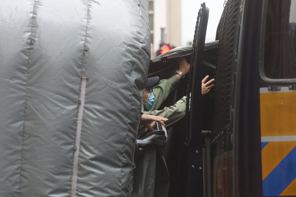 Chow Hang-tung, escorted by prison officers, arrives at the Court of Final Appeal in Central. Photo: Edmond So Chow Hang-tung, escorted by prison officers, arrives at the Court of Final Appeal in Central. Photo: Edmond So