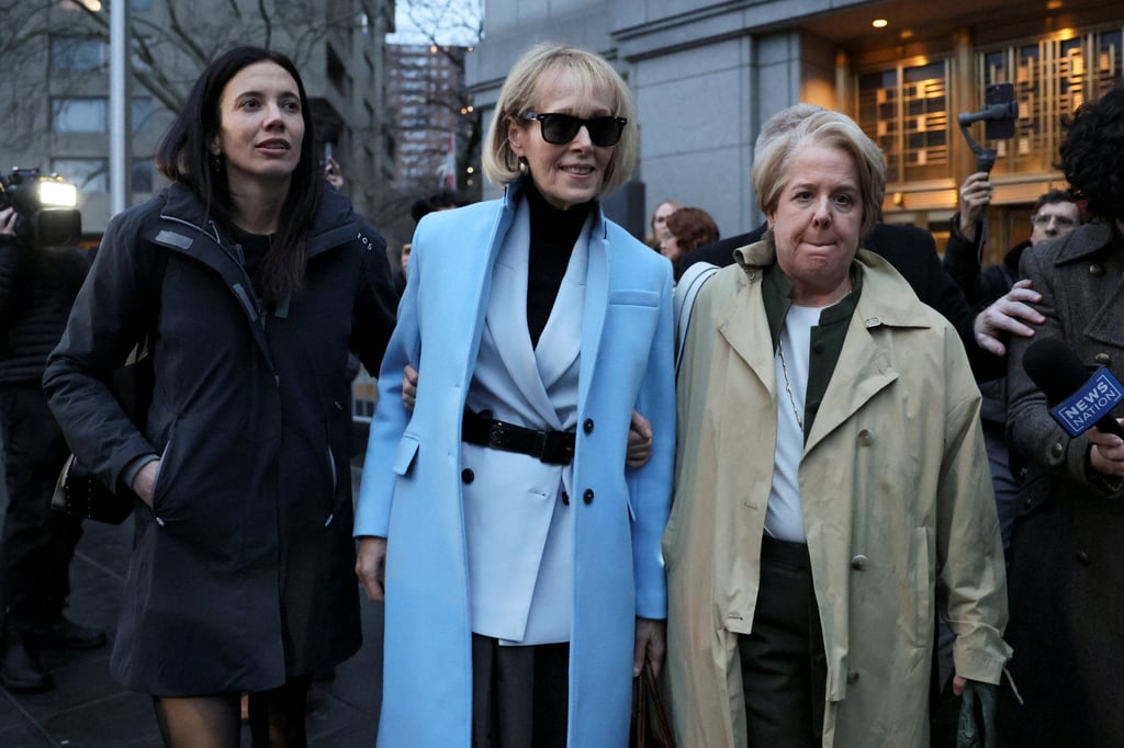 E Jean Carroll, centre, outside Manhattan Federal Court in New York on Thursday. Photo: Reuters E Jean Carroll, centre, outside Manhattan Federal Court in New York on Thursday. Photo: Reuters