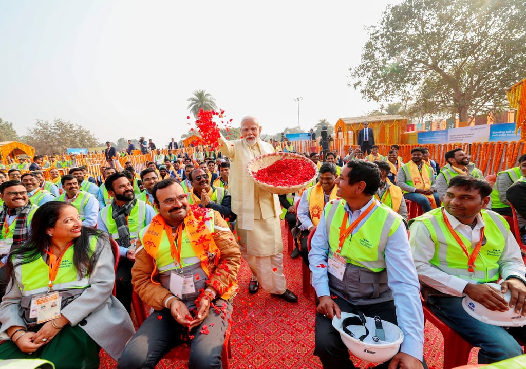 India’s Prime Minister Narendra Modi showers flower petals on the workers during the opening of a grand temple to the Hindu god Lord Ram in Ayodhya, India, on January 22. Photo: India’s Press Information Bureau/Handout via Reuters