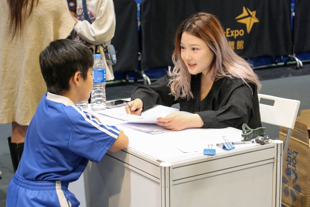 A primary school student from Shenzhen being evaluated by an educational institution at the expo. Photo: Jack Deng A primary school student from Shenzhen being evaluated by an educational institution at the expo. Photo: Jack Deng