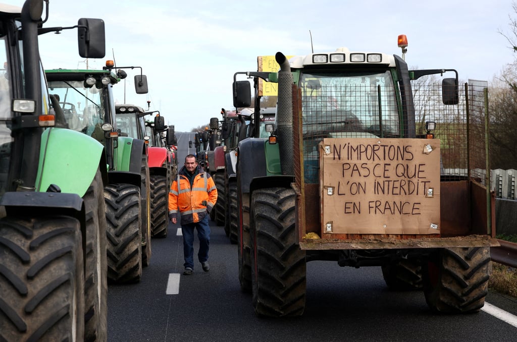 French farmer Regis Bomy near Paris on Friday during nationwide farmers’ protests over price pressures, taxes and green regulation. Photo: Reuters
