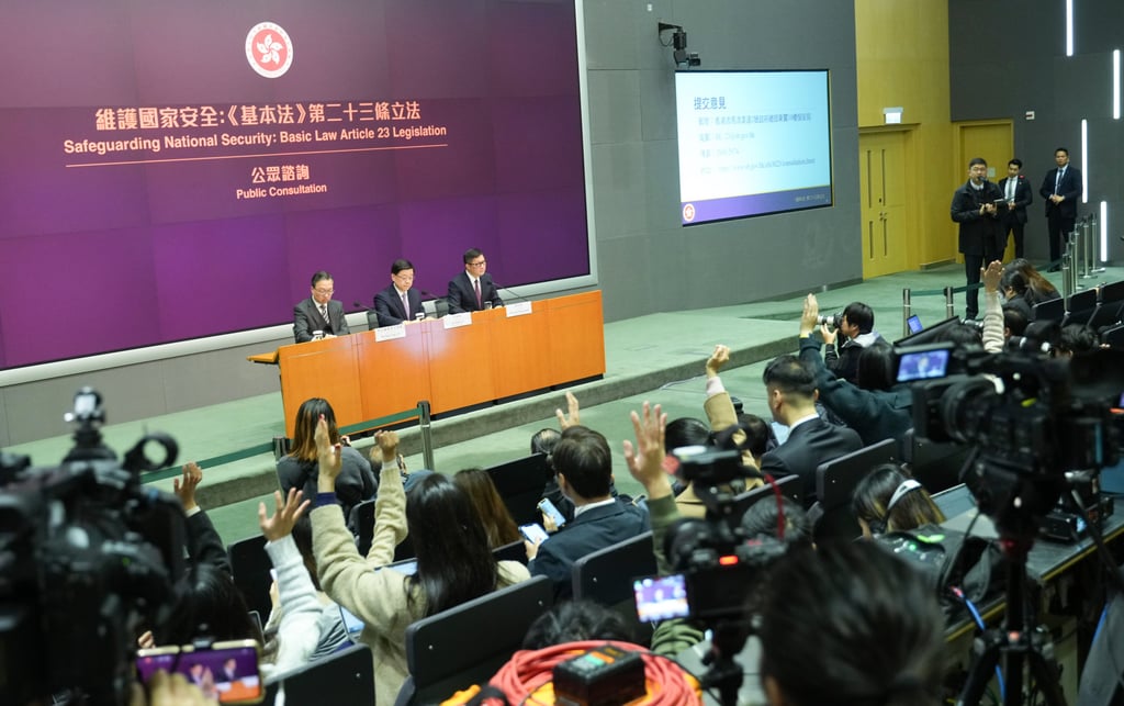 Secretary for Justice Paul Lam (left), Chief Executive John Lee and Secretary for Security Chris Tang announce the public consultation. Photo: Sam Tsang