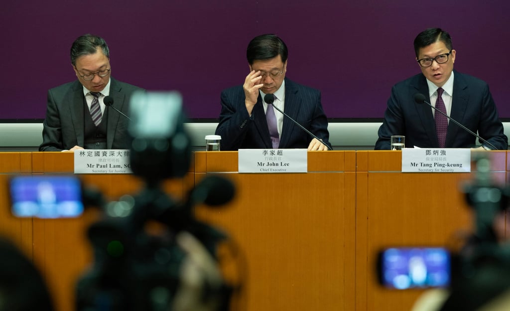 Chief Executive John Lee and Secretary for Security Chris Tan speak during a press conference on the public consultation of the Article 23 legislation. Photo: Robert Ng