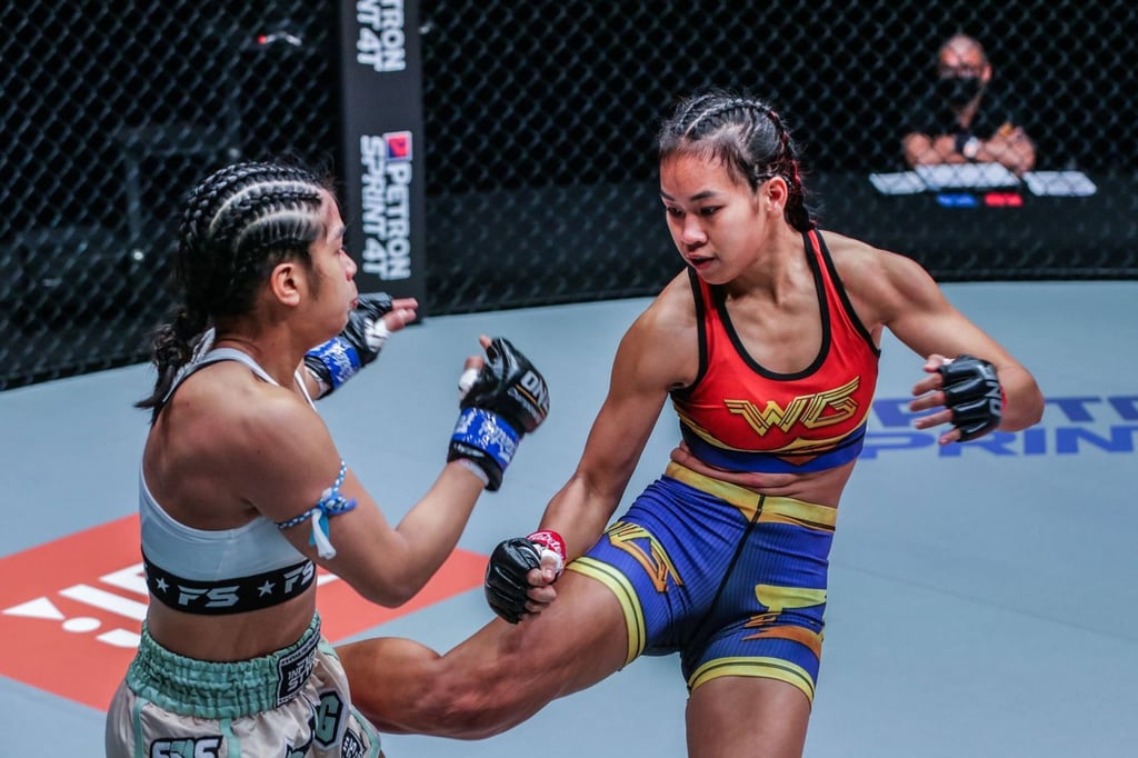 Nat ‘Wondergirl’ Jaroonsak aims a kick at Jackie Buntan during their Fists of Fury clash in 2021. Photo: ONE Championship