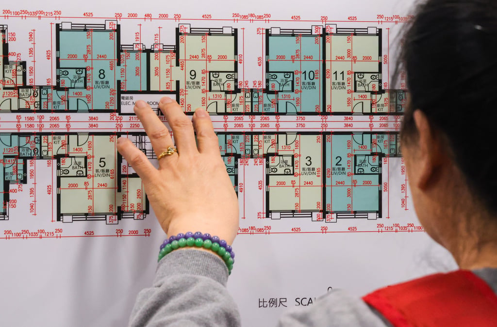 Would-be buyers scrutinise floor plans for Housing Authority subsidised flats. Photo: May Tse
