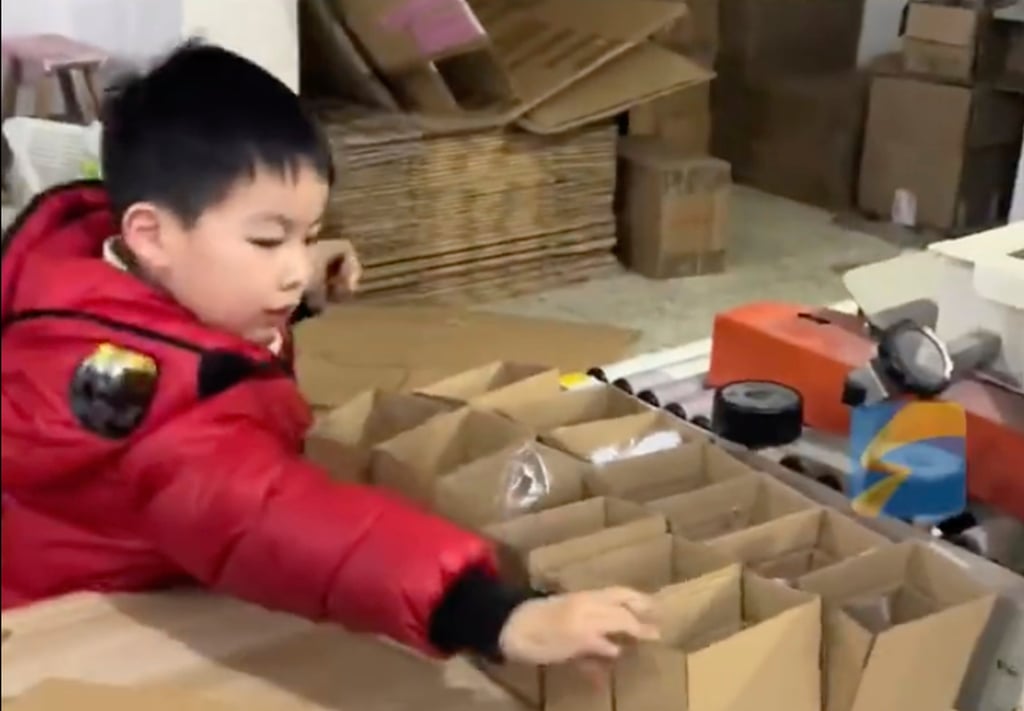 The youngster is so efficient he can pack and label up to 100 boxes every day. Photo: Weibo The youngster is so efficient he can pack and label up to 100 boxes every day. Photo: Weibo