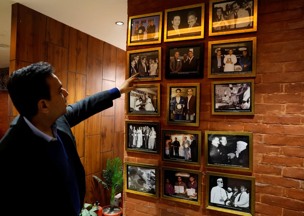 Moti Mahal Delux Managing Director Monish Gujral shows photographs of celebrities and politicians inside the restaurant in New Delhi earlier this month. Photo: Reuters Moti Mahal Delux Managing Director Monish Gujral shows photographs of celebrities and politicians inside the restaurant in New Delhi earlier this month. Photo: Reuters