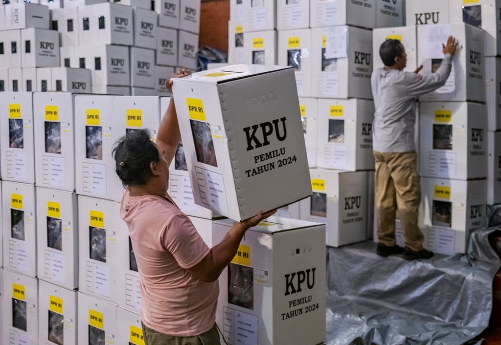 Workers from Indonesia’s election commission prepare ballot boxes at a logistics warehouse in Denpasar last month ahead of the presidential polls. Photo: EPA-EFE Workers from Indonesia’s election commission prepare ballot boxes at a logistics warehouse in Denpasar last month ahead of the presidential polls. Photo: EPA-EFE