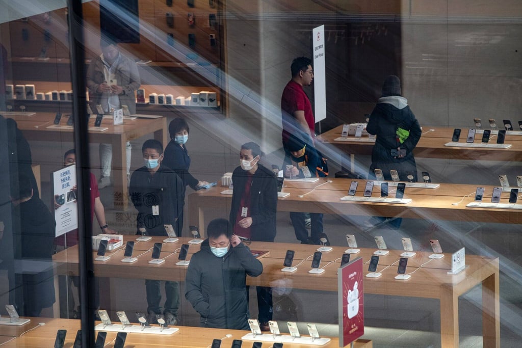 Shoppers are seen inside an Apple Store in Beijing on February 2, 2024. China remains a prized market for Apple, which generates roughly a fifth of its sales there. Photo: Bloomberg Shoppers are seen inside an Apple Store in Beijing on February 2, 2024. China remains a prized market for Apple, which generates roughly a fifth of its sales there. Photo: Bloomberg