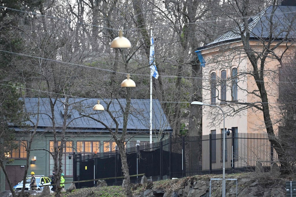 A police car is seen outside the Israeli embassy in Stockholm. Police declined to comment on what the object was, but media have reported it was a hand grenade. Photo: AFP