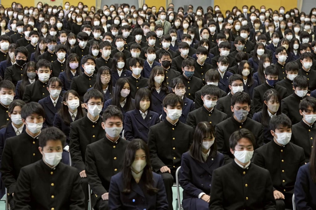 Students at a secondary school in Gifu wear masks at a graduation ceremony on March 1, 2023. Photo: Kyodo Students at a secondary school in Gifu wear masks at a graduation ceremony on March 1, 2023. Photo: Kyodo