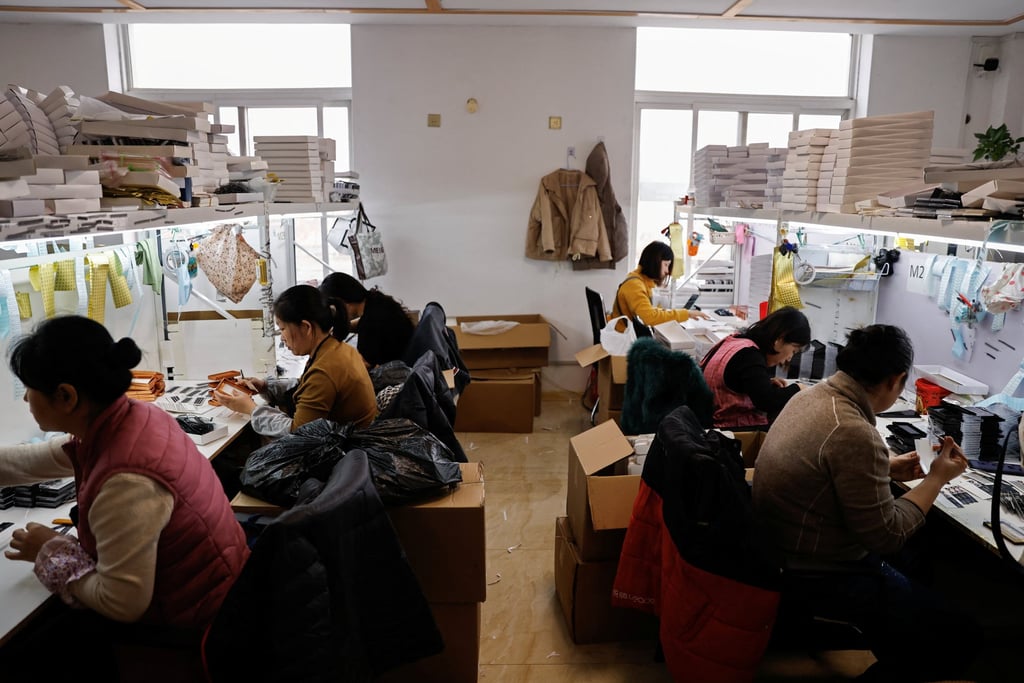 Workers on a production line making false eyelashes in Pingdu, Shandong province, in November. Photo: Reuters Workers on a production line making false eyelashes in Pingdu, Shandong province, in November. Photo: Reuters