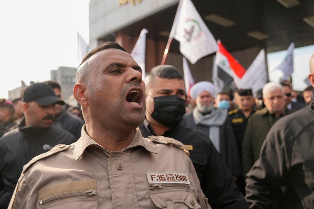 Members of an Iraqi Shiite militant group attend a funeral for the group members who were killed by a US air strike, in Baghdad. Photo: AP