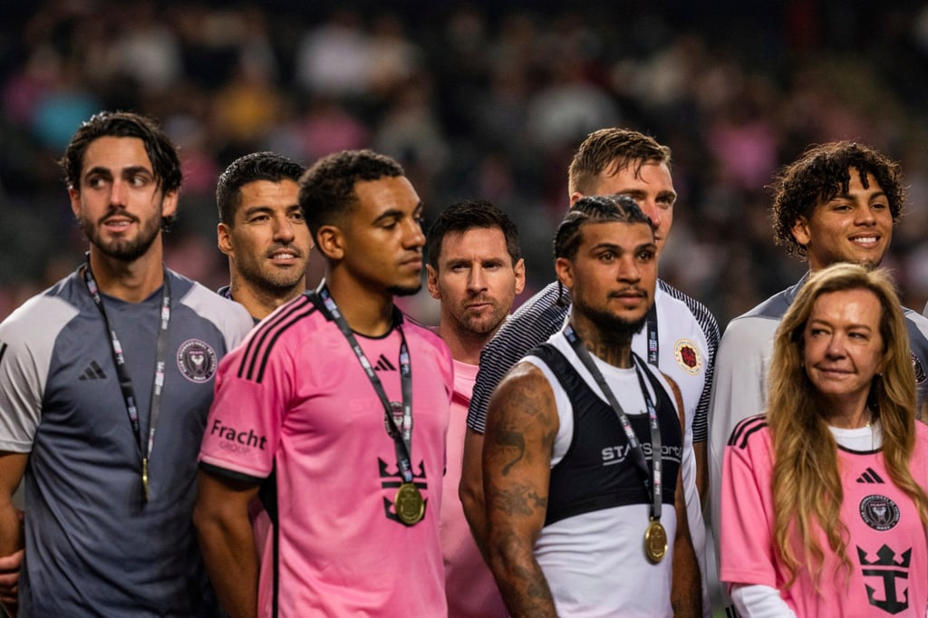 Messi (back, centre) did not play in Hong Kong as fans had to make do with his lesser-known teammates. Photo: AP Messi (back, centre) did not play in Hong Kong as fans had to make do with his lesser-known teammates. Photo: AP