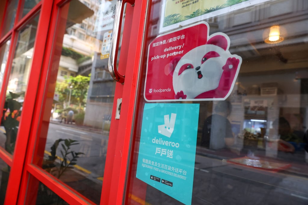 Stickers of Foodpanda and Deliveroo are found on a food establishment. Photo: Dickson Lee