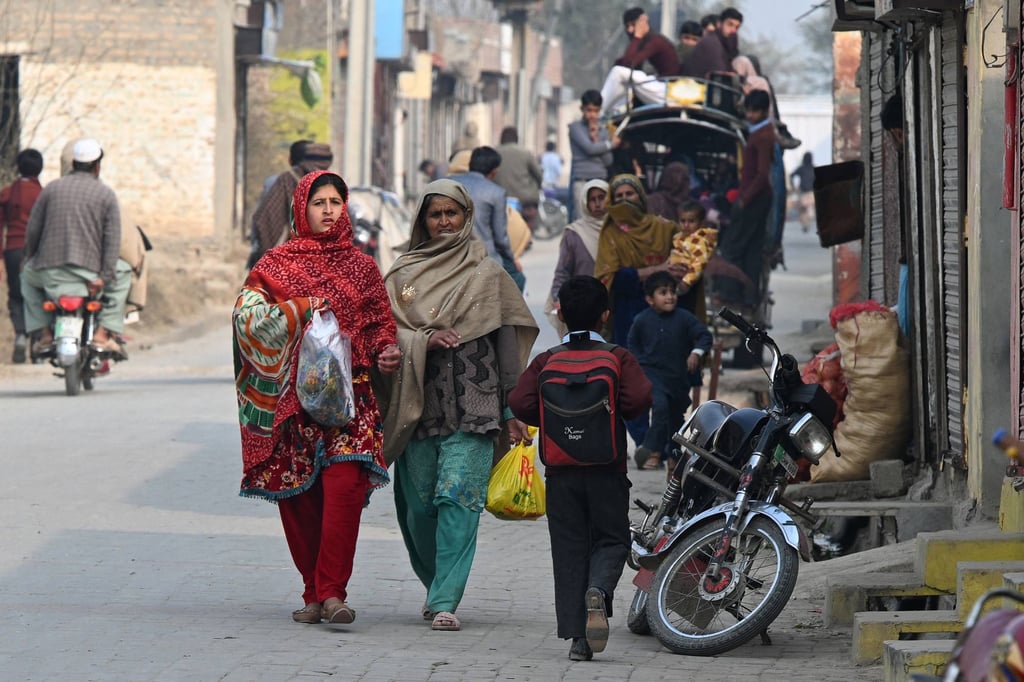 Pakistani women walk along a street in Dhurnal ahead of the general election. Photo: AFP Pakistani women walk along a street in Dhurnal ahead of the general election. Photo: AFP