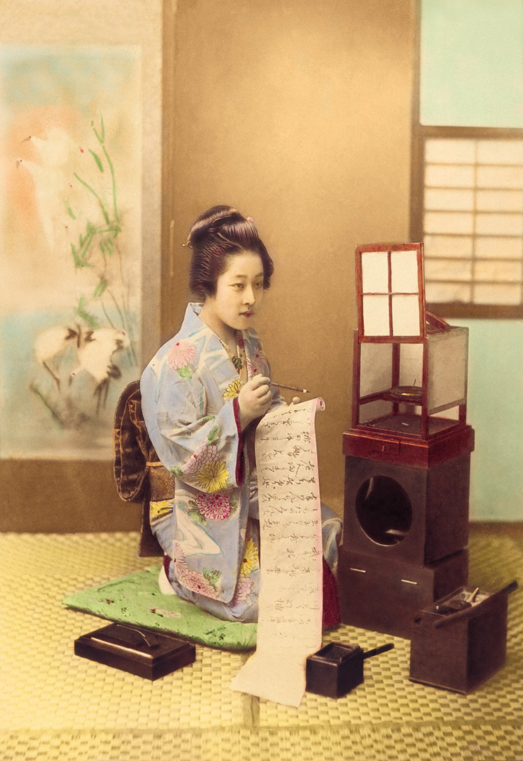 A kimono-clad Japanese woman writes on a paper scroll, circa 1897. Photo: Getty Images A kimono-clad Japanese woman writes on a paper scroll, circa 1897. Photo: Getty Images