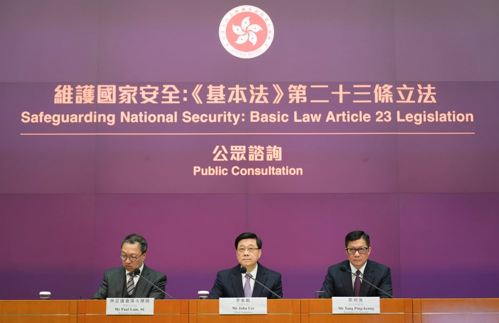 (From left) Secretary for Justice Paul Lam, Chief Executive John Lee and Secretary for Security Chris Tang discuss the public consultation on national security legislation. Photo: Sam Tsang (From left) Secretary for Justice Paul Lam, Chief Executive John Lee and Secretary for Security Chris Tang discuss the public consultation on national security legislation. Photo: Sam Tsang