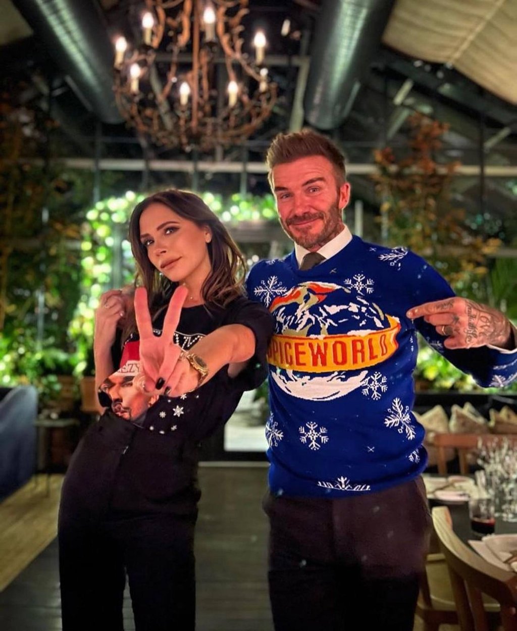 David Beckham (right) wearing a Spice World-themed Christmas jumper and posing with his wife Victoria. Photo: @davidbeckham/Instagram David Beckham (right) wearing a Spice World-themed Christmas jumper and posing with his wife Victoria. Photo: @davidbeckham/Instagram