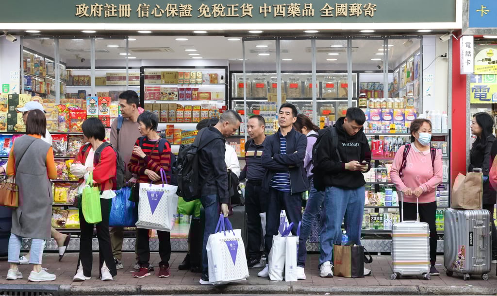 Passengers wait to board a cross-boundary bus service at Prince Edward. Photo: Jelly Tse