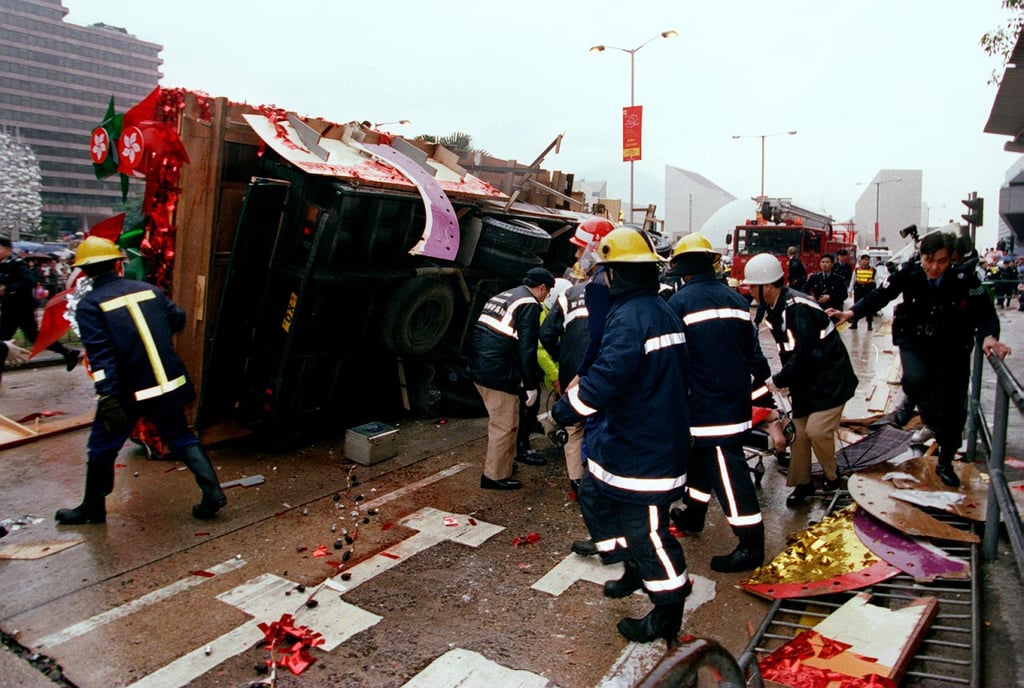 Emergency crews attend to a victim of the accident which happened when a Lunar New Year parade float (left) careered into the crowd in Tsim Sha Tsui in February 1997. Photo: Dustin Shum