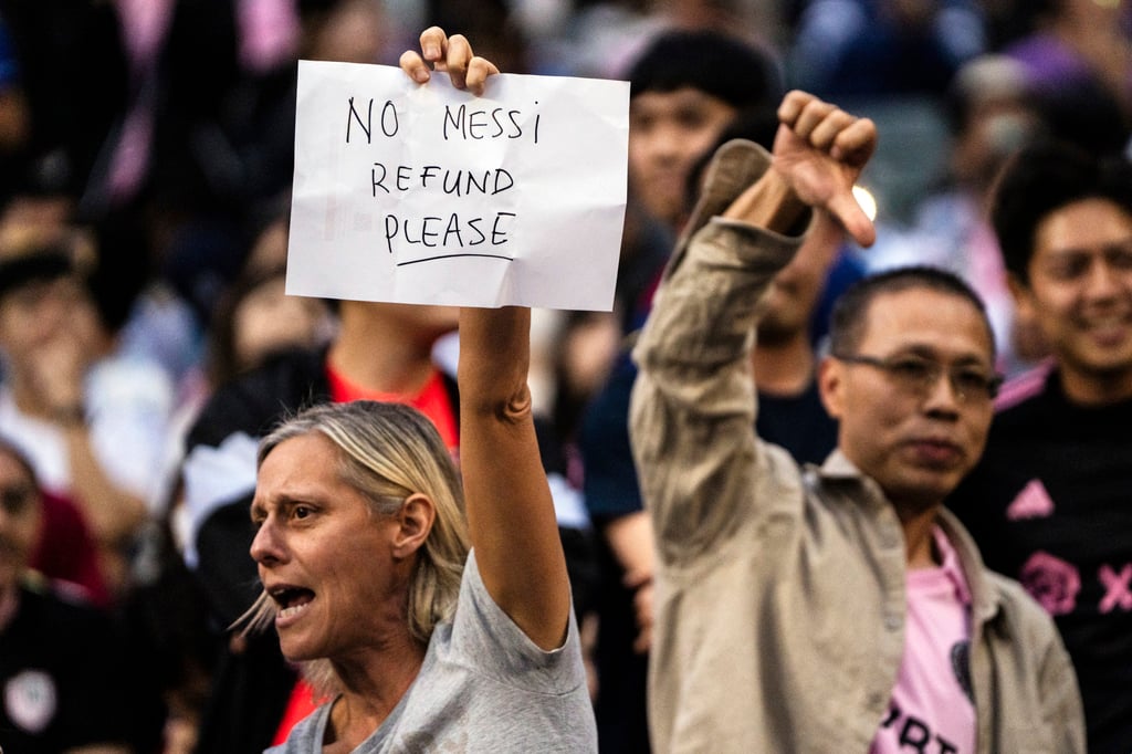 Fans react to Messi’s non-appearance during the exhibition match in Hong Kong. Photo: AP