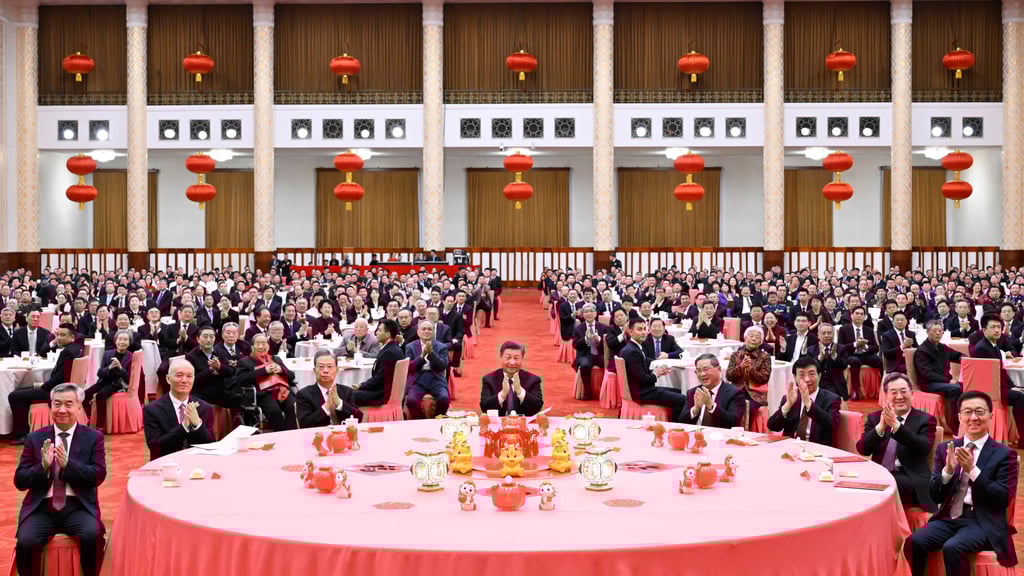 Chinese President Xi Jinping (centre) attends the Spring Festival gathering hosted by Premier Li Qiang (seated fourth from right) at the Great Hall of the People in Beijing on Thursday. Photo: Xinhua