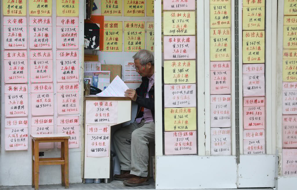 A man works in a local property agency in Wan Chai on January 3, 2024. Photo: Sun Yeung A man works in a local property agency in Wan Chai on January 3, 2024. Photo: Sun Yeung