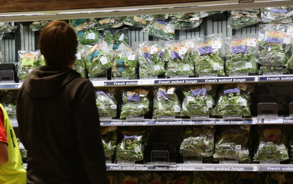 A customer looks at baby spinach at a supermarket in Sydney. With the price of other goods including energy also soaring, a cost of living crisis is dominating national discourse in Australia. Photo: Xinhua A customer looks at baby spinach at a supermarket in Sydney. With the price of other goods including energy also soaring, a cost of living crisis is dominating national discourse in Australia. Photo: Xinhua