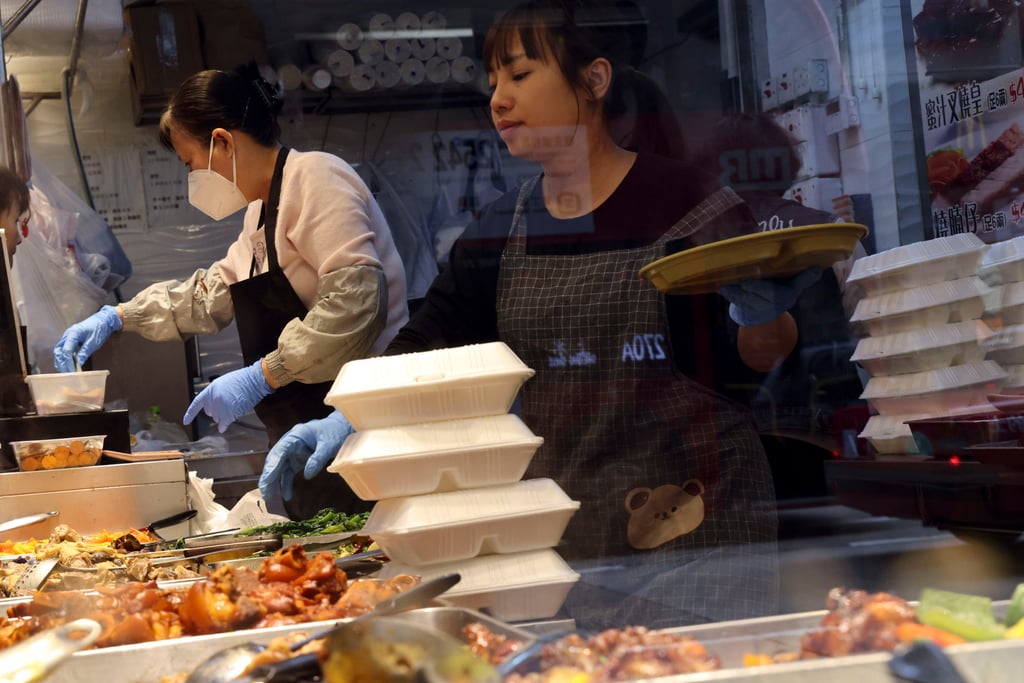 Restaurant staff using soon-to-be-banned single-use plastic lunchboxes to pack takeaway food. Photo: Jelly Tse Restaurant staff using soon-to-be-banned single-use plastic lunchboxes to pack takeaway food. Photo: Jelly Tse
