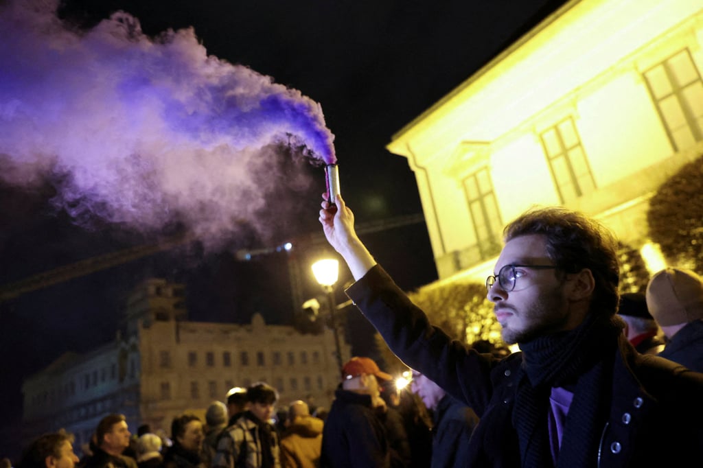 Protesters demand the resignation of Hungarian President Katalin Novak near Sandor Palace in Budapest on Friday. Photo: Reuters Protesters demand the resignation of Hungarian President Katalin Novak near Sandor Palace in Budapest on Friday. Photo: Reuters
