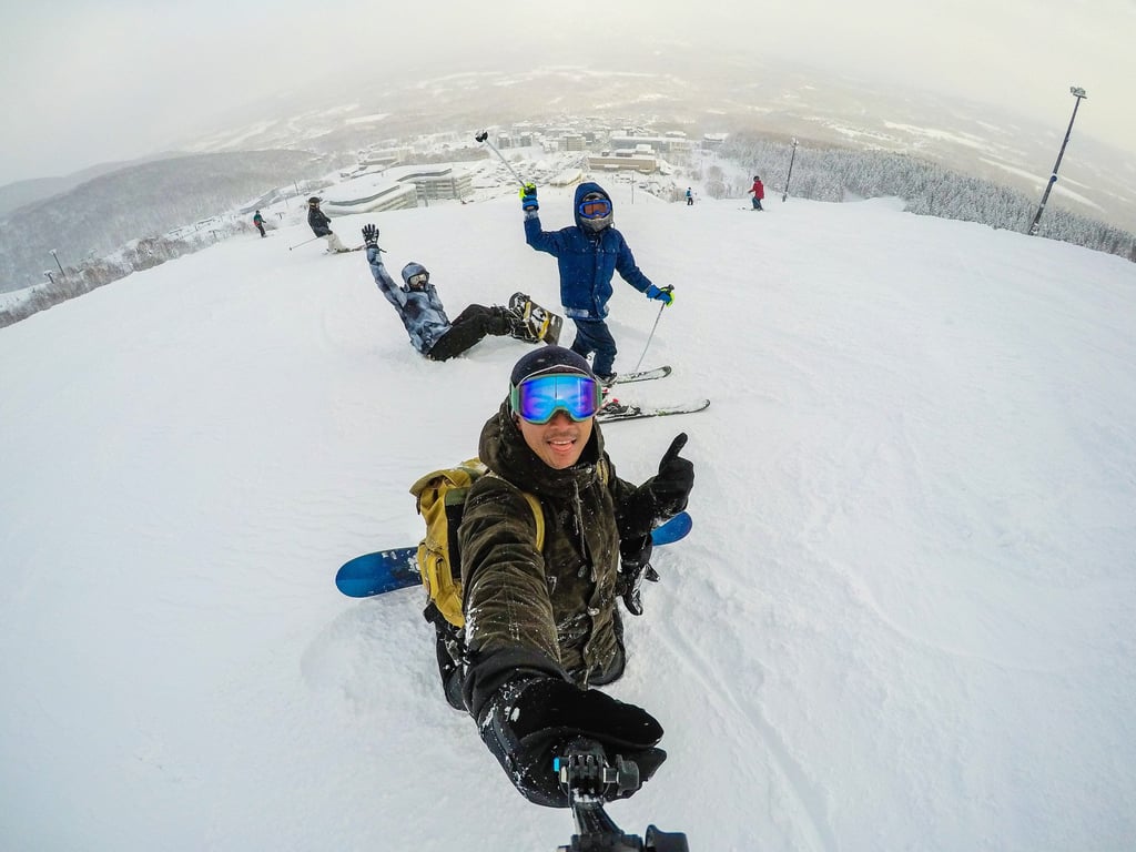 Snowboarding in Niseko, Japan. The region’s ample powdery snow makes it a popular winter sports destination. Photo: Getty Images