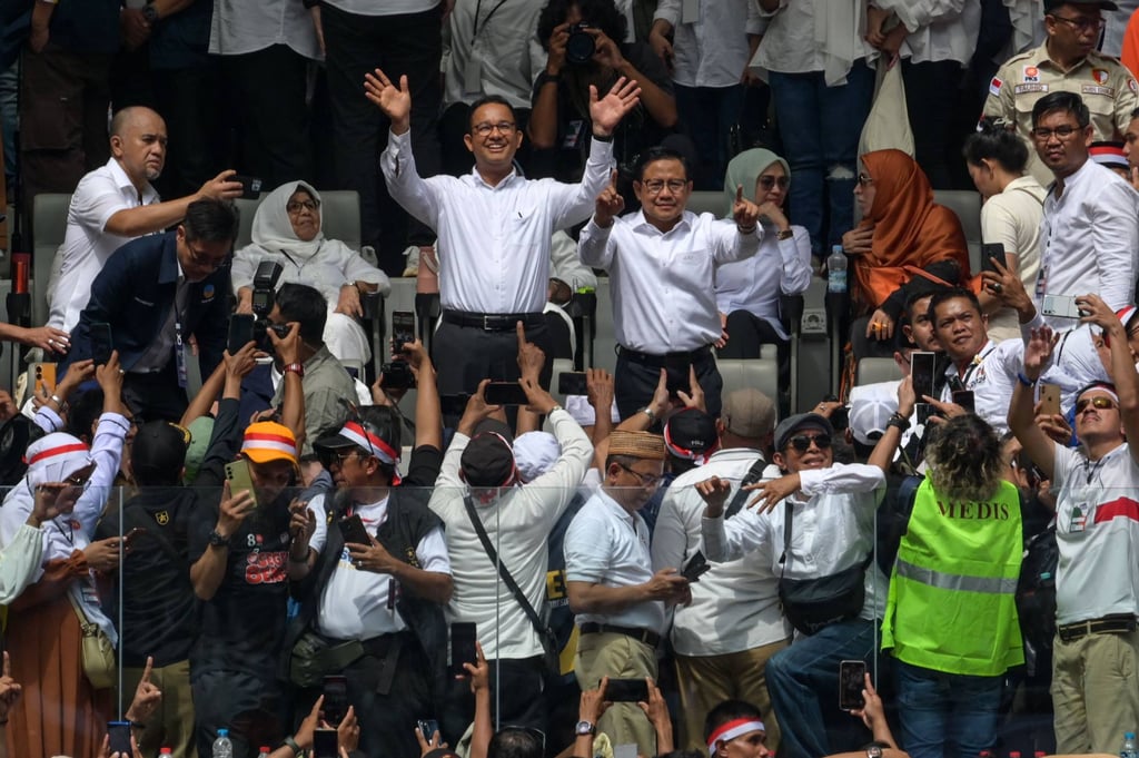 Anies Baswedan (centre, left) and Muhaimin Iskandar (centre, right) greet supporters during their final campaign rally on Saturday at the Jakarta International Stadium. Photo: AFP Anies Baswedan (centre, left) and Muhaimin Iskandar (centre, right) greet supporters during their final campaign rally on Saturday at the Jakarta International Stadium. Photo: AFP