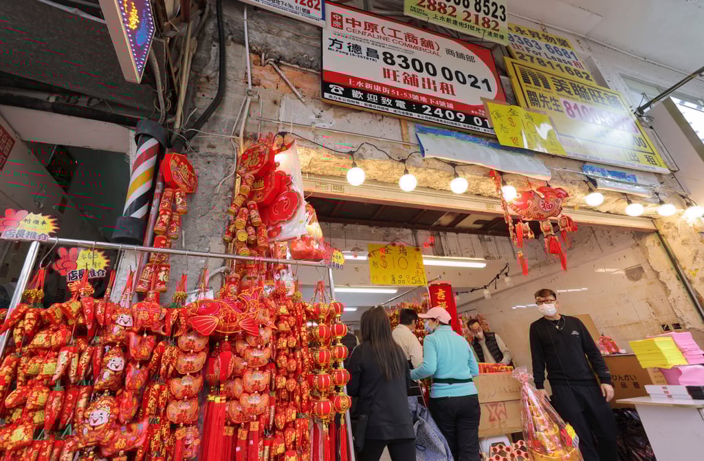 Cross-border shoppers at a store selling Lunar New Year decorations in Sheung Shui. The holiday has seen Hong Kong continue a bounce back from the decimation of cross-border tourism by pandemic travel curbs. Photo: Jelly Tse