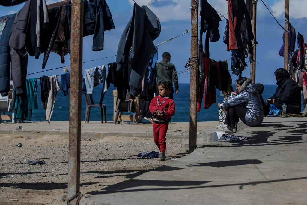 A displaced Palestinian child and her family from Rafah shelter in Deir Al Balah in the southern Gaza Strip on Wednesday. Photo: EPA-EFE A displaced Palestinian child and her family from Rafah shelter in Deir Al Balah in the southern Gaza Strip on Wednesday. Photo: EPA-EFE