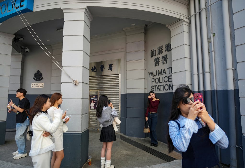 Mainland Chinese tourists visit the former Yau Ma Tei Police Station. A tour operator said Hong Kong should preserve its uniqueness to retain tourists. Photo: Sam Tsang Mainland Chinese tourists visit the former Yau Ma Tei Police Station. A tour operator said Hong Kong should preserve its uniqueness to retain tourists. Photo: Sam Tsang