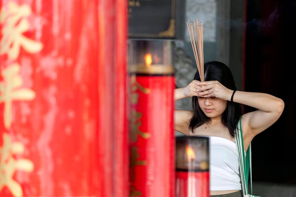 Lunar New Year’s Day prayers at a temple in Denpasar. Photo: EPA-EFE