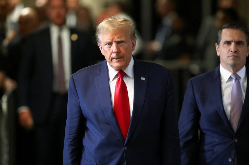 Former US President Donald Trump arrives for court hearing on charges of falsifying business records to cover up a hush money payment to a porn star before the 2016 election. Photo: Reuters