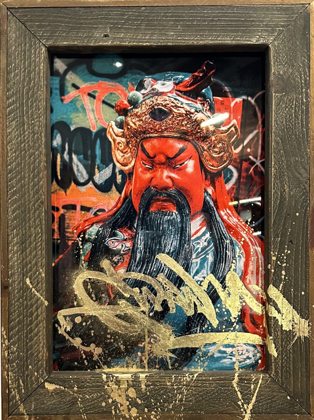 A photo titled Gwan features gold leaf across the photograph and its wooden frame. Photo: Dickie Suzuki A photo titled Gwan features gold leaf across the photograph and its wooden frame. Photo: Dickie Suzuki