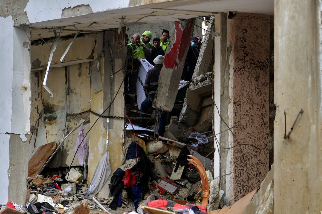 Rescuers on Thursday inspect the wreckage of a five-storey building in Nabatieh, Lebanon that was targeted by Israeli drones, killing at least five people. Photo: dpa