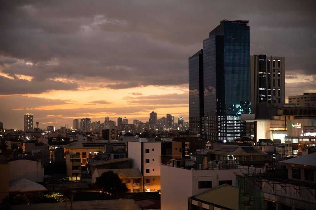 Buildings are seen at dusk in Makati City, Metro Manila. With its strategic location, Manila’s main airport ought to be one of Southeast Asia’s main gateways to elsewhere in the region and beyond. Photo: Bloomberg