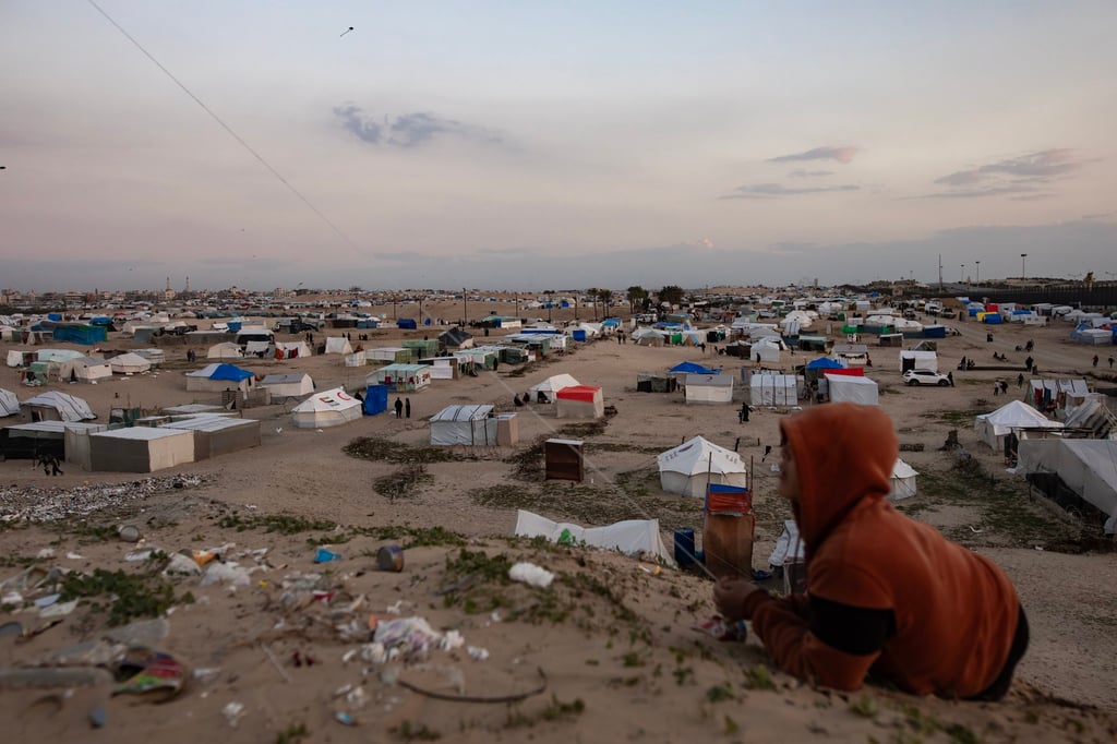 A boy flies a kite in front of the tents of internally displaced Palestinians in the Rafah refugee camp in the southern Gaza Strip on Friday. Photo: EPA-EFE A boy flies a kite in front of the tents of internally displaced Palestinians in the Rafah refugee camp in the southern Gaza Strip on Friday. Photo: EPA-EFE