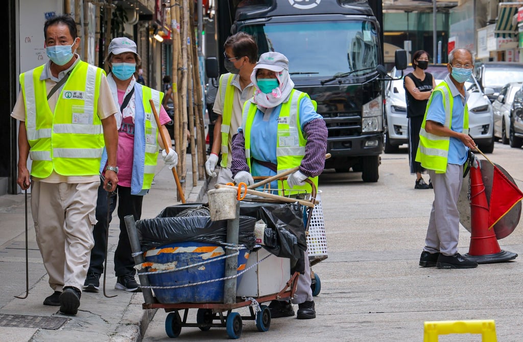 A cleaner hauls a trolley in Jordan. Researchers say their new trolley can help workers transport heavy loads easily. Photo: Jelly Tse